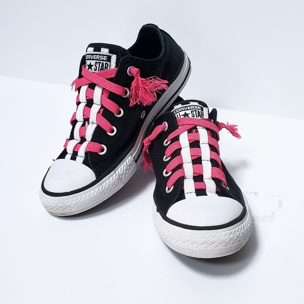 Pink and black converse